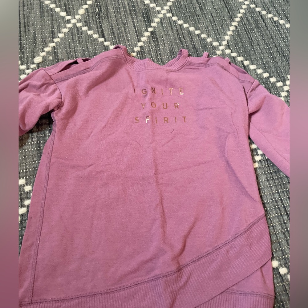 Purple long sleeve that says ignite your spirit